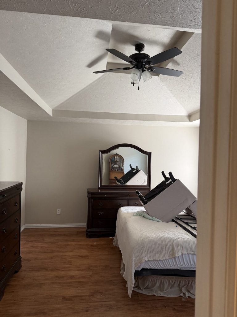 Furniture staged on a bed during a Legend Movers house move